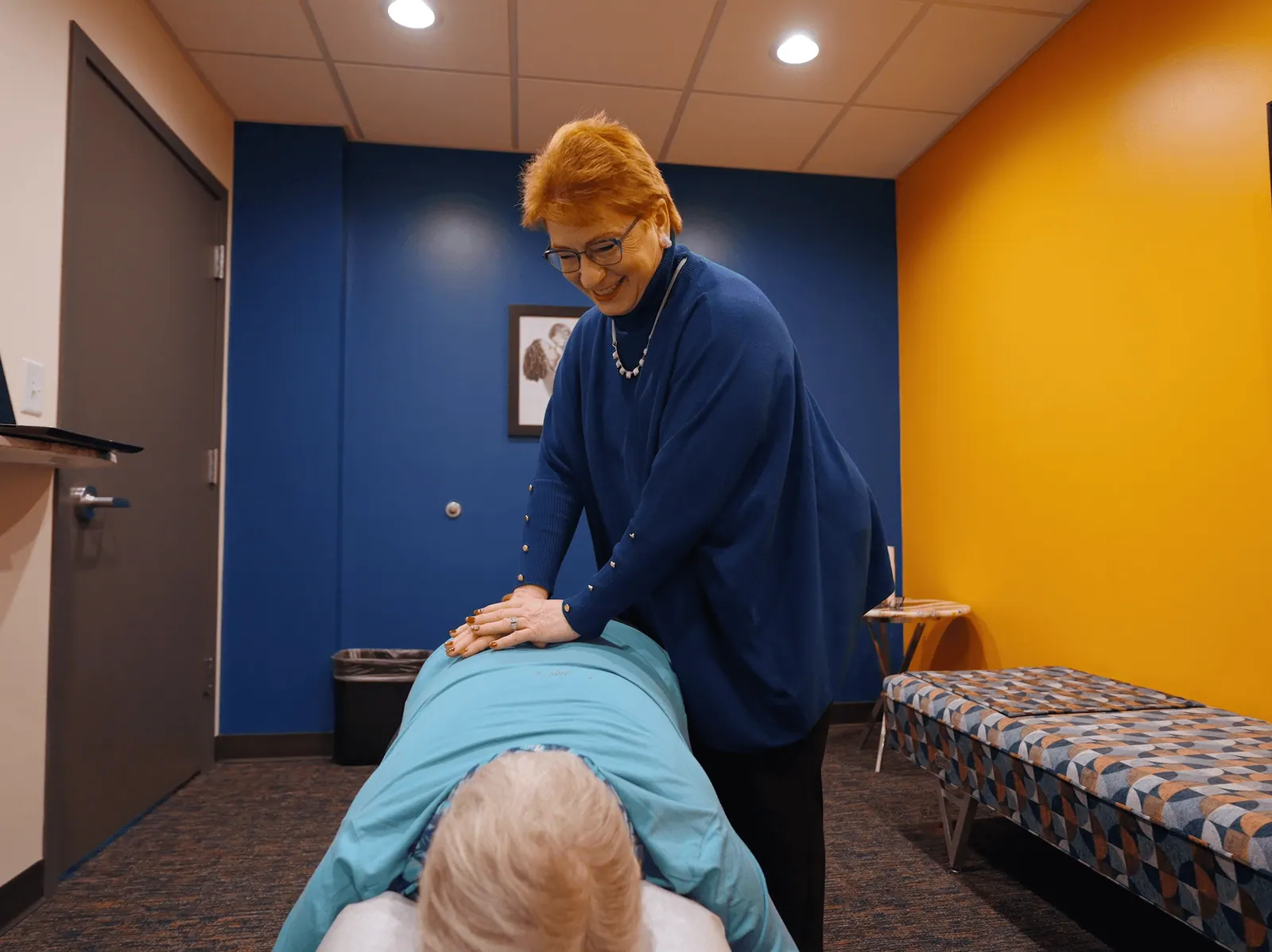 Dr. Trish Wolff performing a chiropractic adjustment on a patient