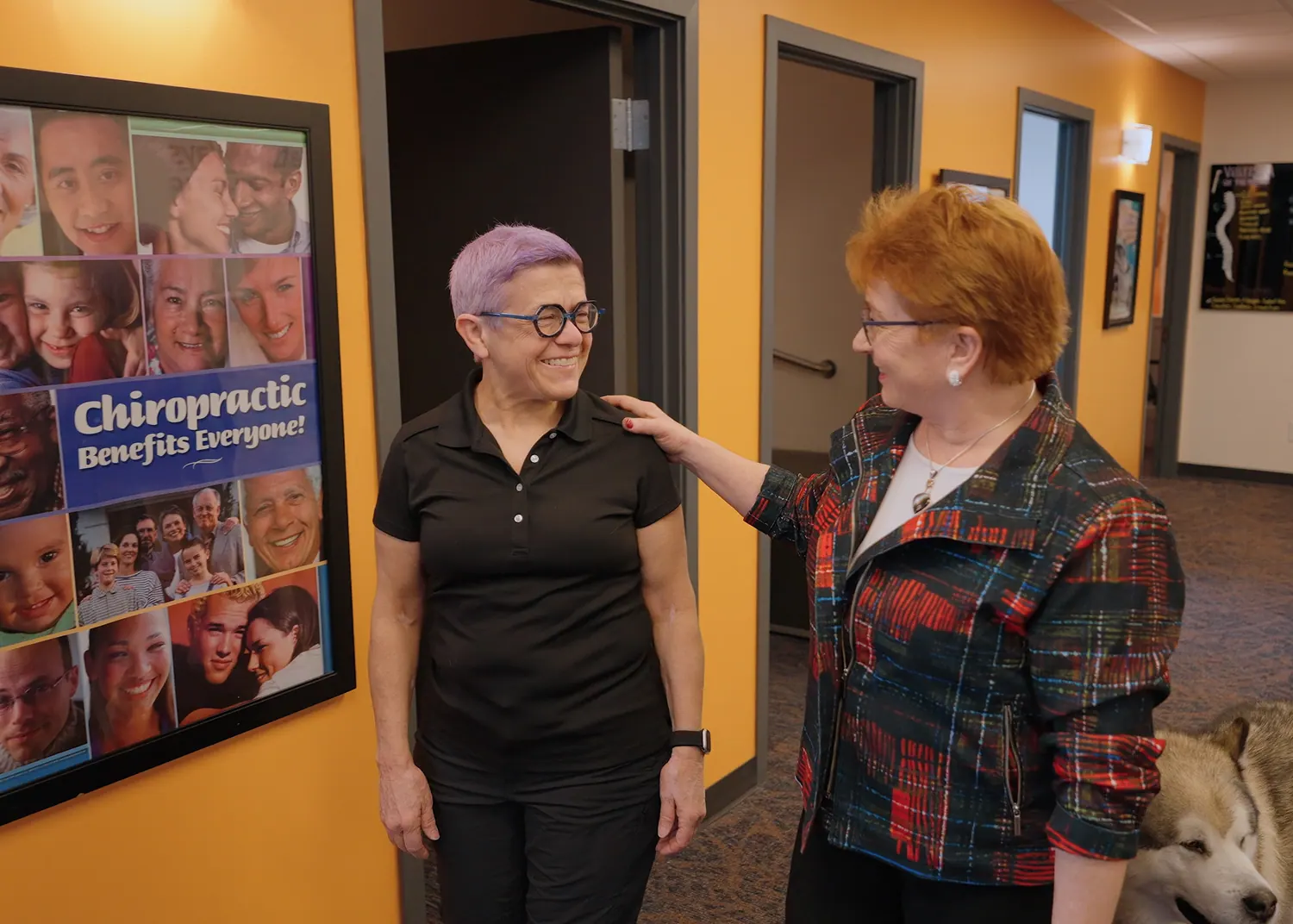 Dr. Trish Wolff greeting a patient in the hallway