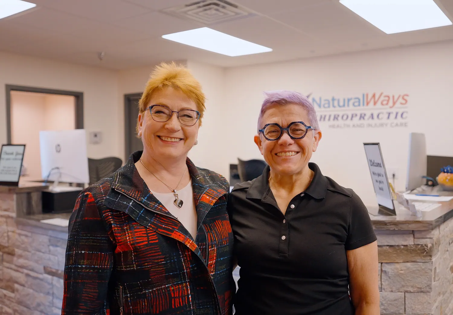 Dr. Trish Wolff with a patient at the front desk
