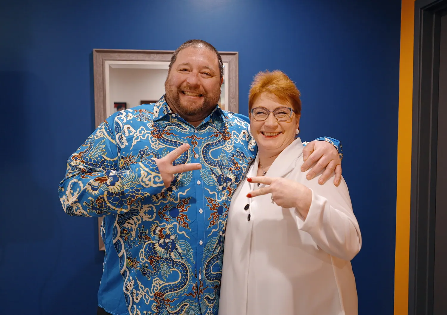 Dr. Trish Wolff and a patient giving a cheerful hand sign