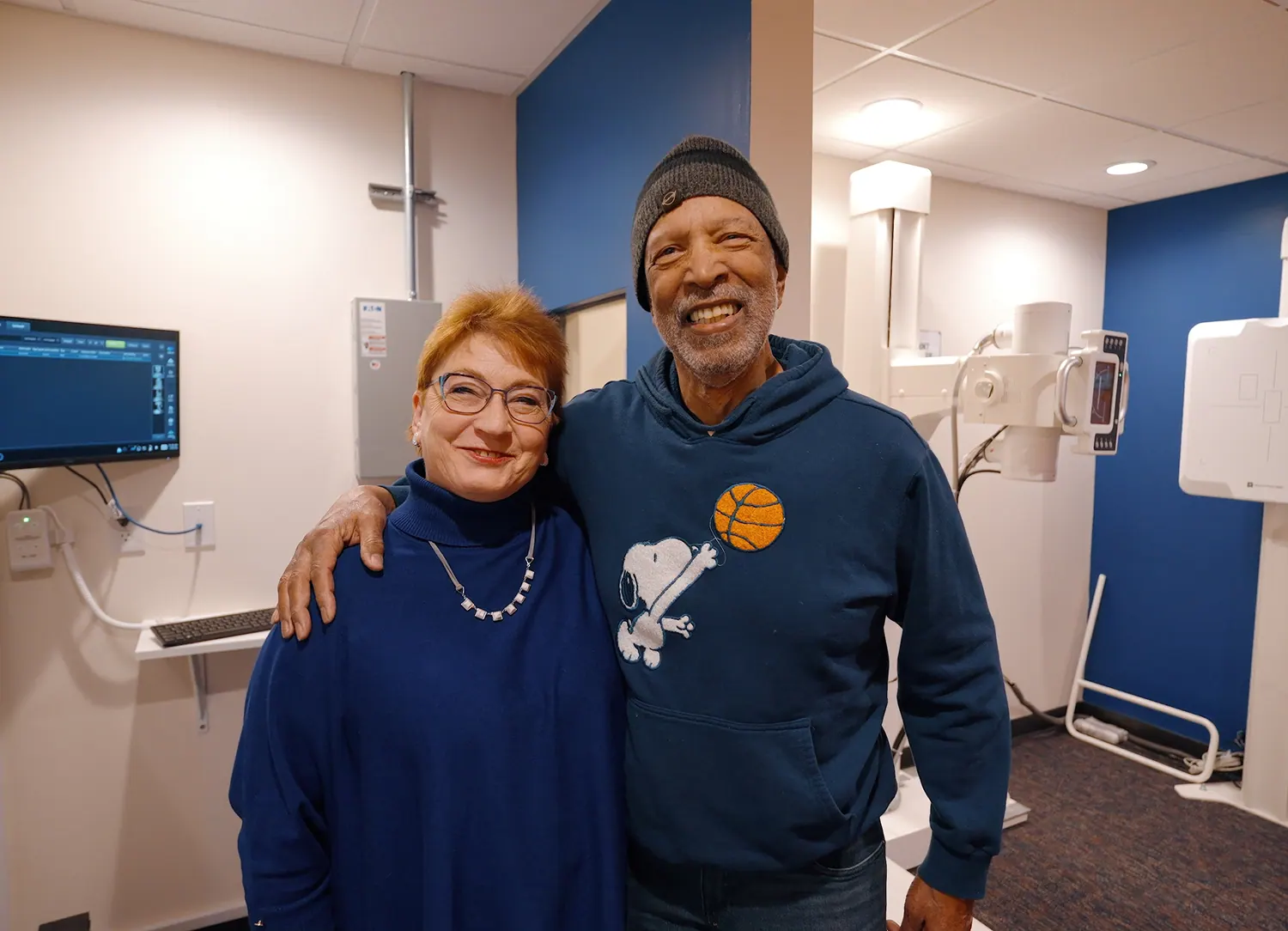 Dr. Trish Wolff with a smiling patient in the X-ray room