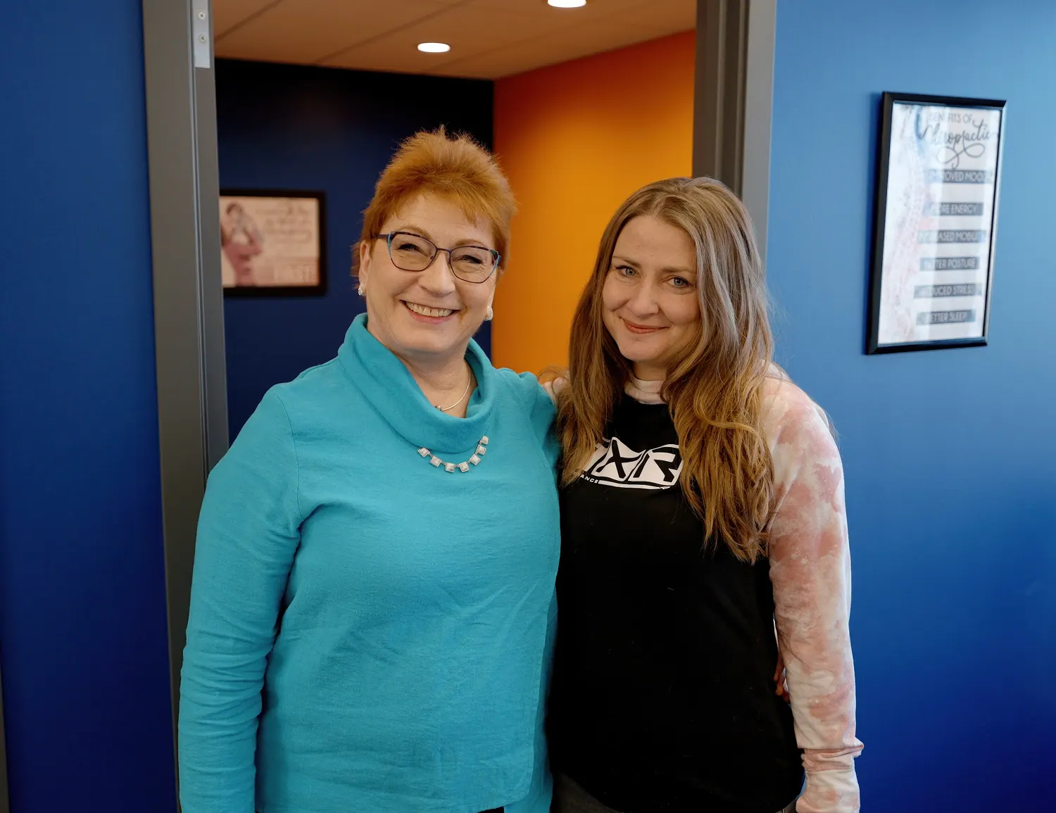 Dr. Trish Wolff with a young woman patient