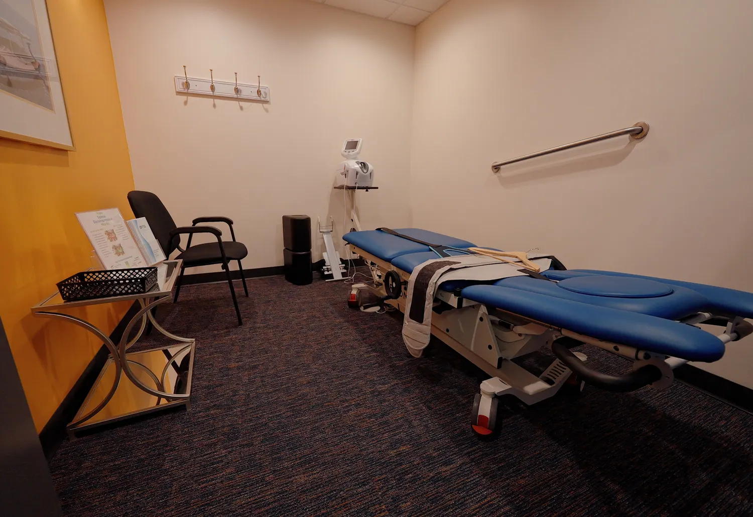 Treatment room with a spinal decompression table