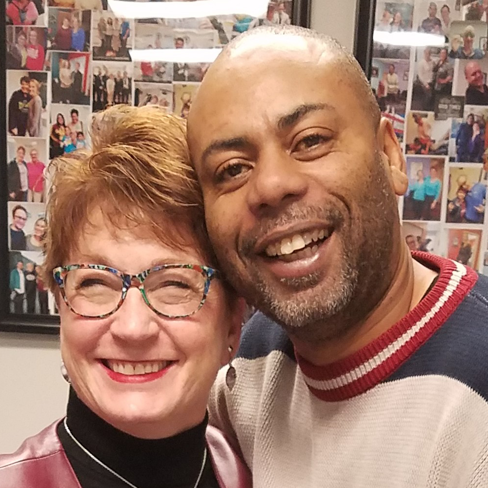 Dr. Trish Wolff working with male patient in Roseville clinic